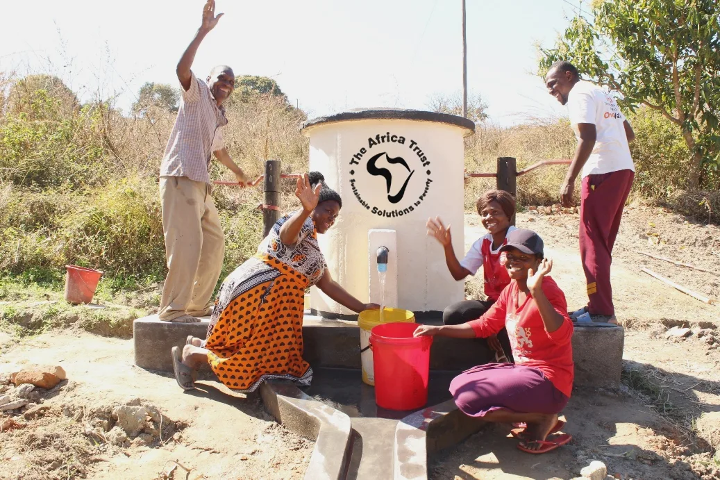 AT Logo - Women and Men pumping water copy AT Logo - Women and Men pumping water