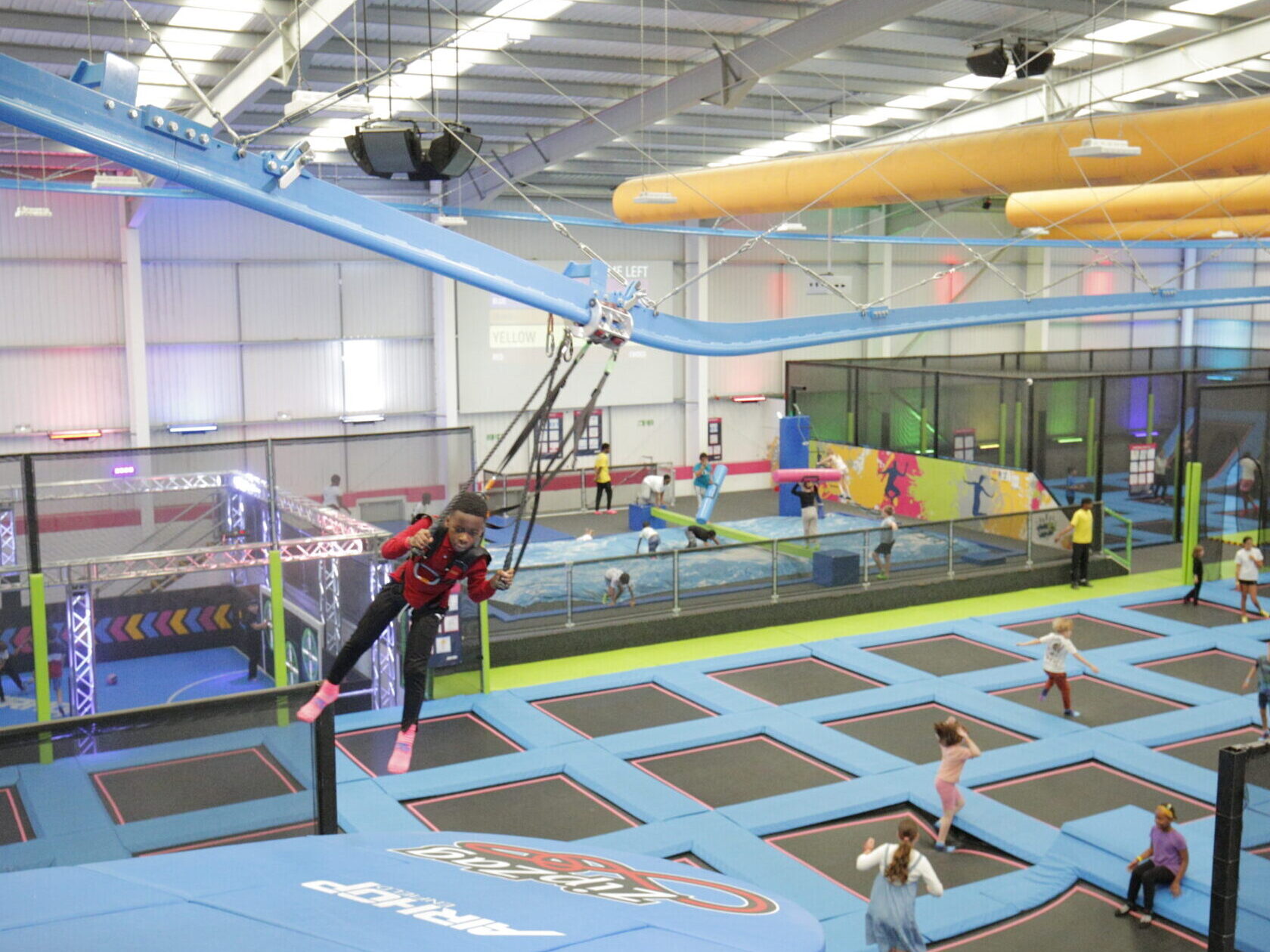 Child arriving at the landing platform on the AirGlider at AirHop Enfield