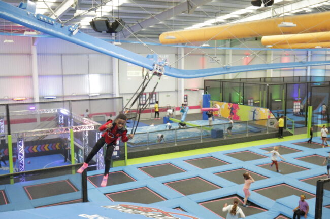 Child arriving at the landing platform on the AirGlider at AirHop Enfield